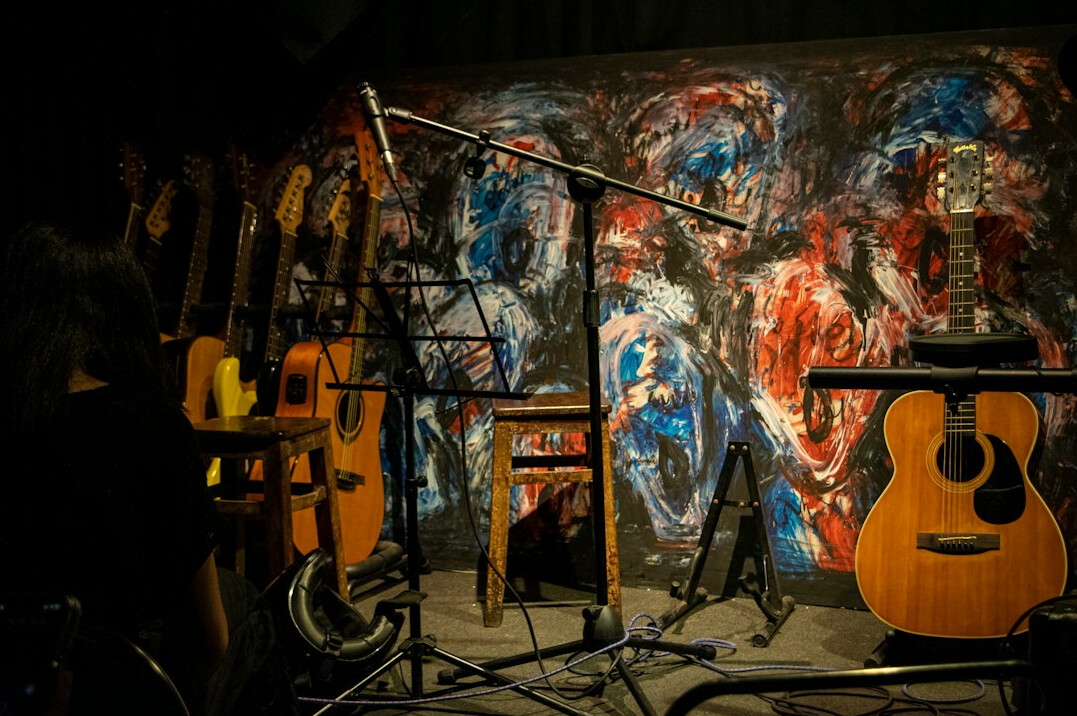 Podcast style studio with microphones and acoustic panels