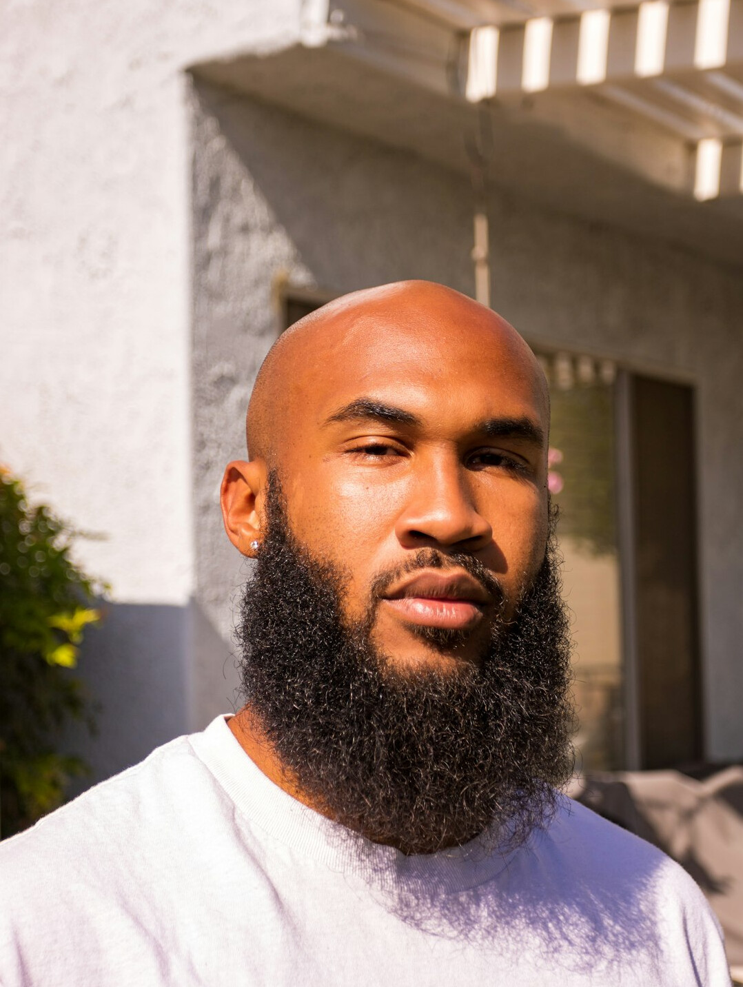 Portrait of a man with a trimmed beard looking at the camera